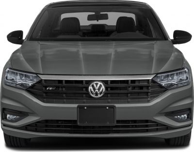 Close-up of a front grille with R-Line badge and LED headlights.