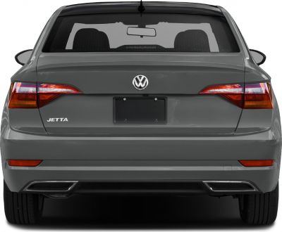 Rear view with distinctive tail lights and dual exhaust outlets