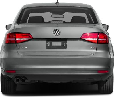 Rear view with taillights, dual exhausts, TSI badge