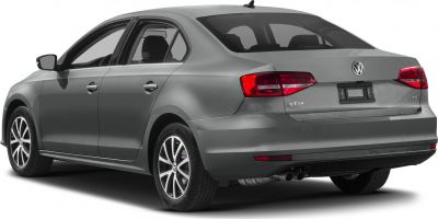 Side-rear view of a sedan with dual exhaust and alloy wheels