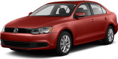 Red sedan frontal side view with sleek headlights and alloy wheels