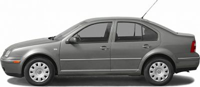 Side profile of a sedan with four doors, visible windows, and wheel hubcaps.