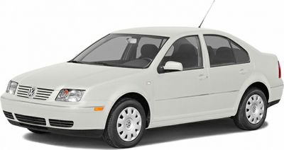 White sedan with front grille, headlights, and four doors
