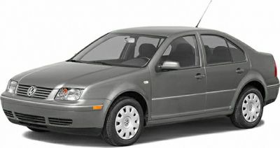Front side profile with distinct headlights and sedan body style