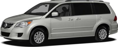 Side view of a silver minivan with sliding door and roof rails