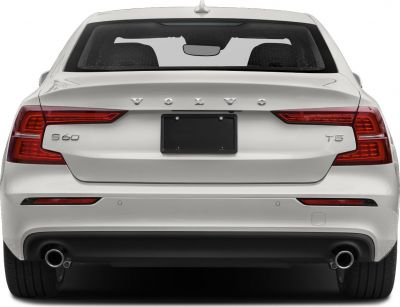 Rear view with distinctive tail lights and dual exhausts.