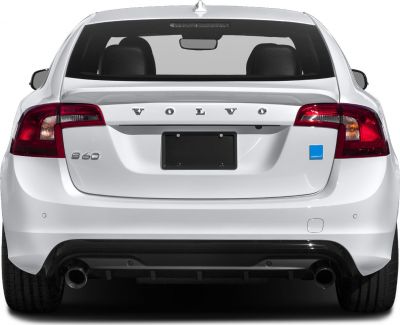 Rear view of a white Volvo sedan with dual exhaust and distinct taillights