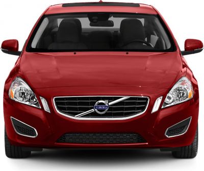 Front view with grille and headlights of a red sedan
