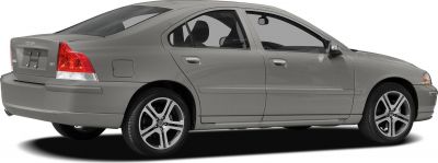 Silver sedan rear side profile with alloy wheels and distinctive tail lights