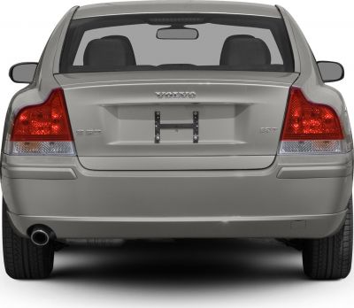 Rear view with distinctive taillights and single exhaust pipe
