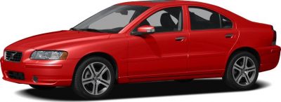 Side view of red sedan with alloy wheels and sleek body design