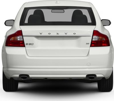 White sedan rear with dual exhausts and distinctive tail lights