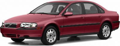 Red four-door sedan with front side view and classic grille