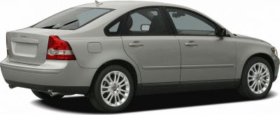 Rear-side profile of mid-size sedan with taillights and alloy wheels