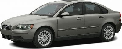 Silver compact sedan front side view with alloy wheels and headlights