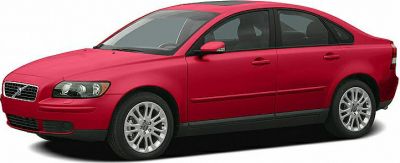 Red sedan front side view with alloy wheels and sunroof