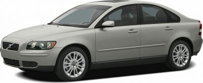 Front side view of a silver compact sedan with alloy wheels