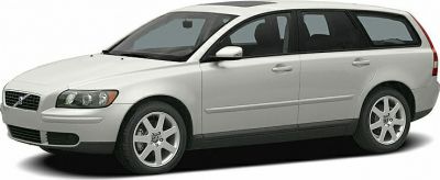 Front side view of white station wagon with alloy wheels