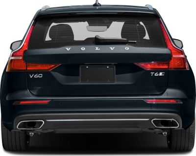 Rear tail lights and dual exhaust of a modern station wagon