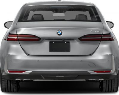 Modern sedan rear with LED tail lights and streamlined trunk design