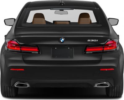Rear view of 5 Series sedan with tail lights and dual exhausts