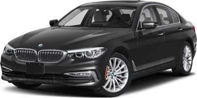 Front view of luxury sedan with LED headlights and alloy wheels