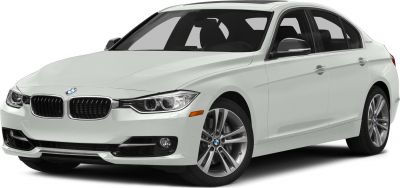 White sedan showing front grille, headlights, and alloy wheels