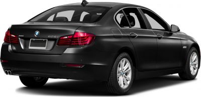 Rear view of luxury sedan featuring taillights and dual exhaust pipes