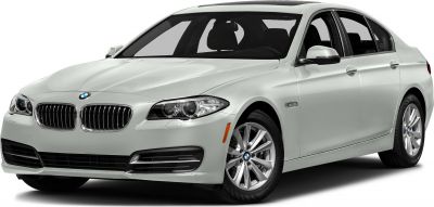 Front-side view of silver luxury sedan with distinctive grille and headlights