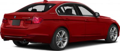 Red sedan rear side view with dual exhaust and alloy wheels