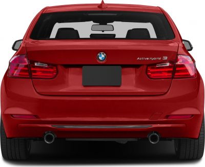 Rear view with hybrid badge, dual exhausts, and modern taillights