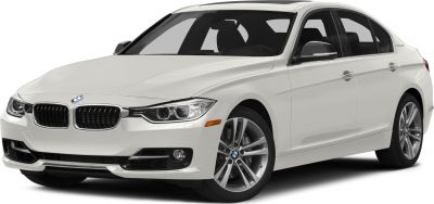 White BMW sedan front side with alloy wheels and headlights