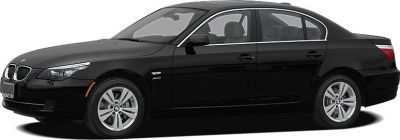 Side profile of a black sedan with distinct alloy wheels.