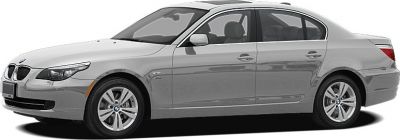 Silver sedan side profile with sleek headlights and alloy wheels