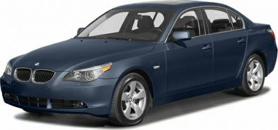 Front-side view of a mid-size luxury sedan with alloy wheels and classic design
