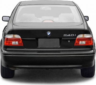Rear view with distinctive tail lights and BMW emblem on a black luxury sedan.