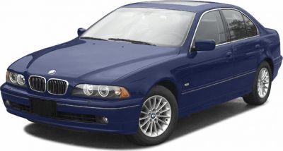 Blue sedan front view with dual headlights and alloy wheels
