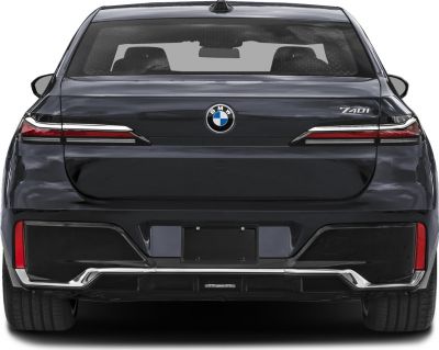 Rear view with slim tail lights, BMW logo, and 740i badge