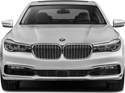 Front view with kidney grille and sleek headlights of luxury sedan