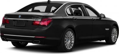 Rear and side view of luxury sedan with distinct taillights and alloy wheels
