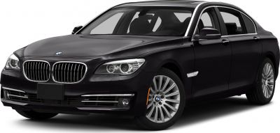 Luxury sedan front with signature grille and alloy wheels