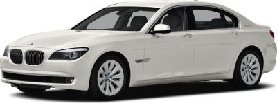 Front and side profile of a white luxury hybrid sedan.