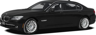 Side view of sleek black luxury sedan with kidney grille and alloy wheels