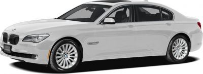 White luxury sedan with front kidney grille and elongated wheelbase.