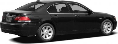 Rear side view of luxury sedan with alloy wheels