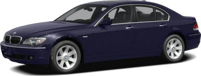 Dark blue luxury sedan front side view with alloy wheels