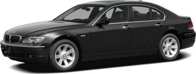 Side profile of black luxury sedan with alloy wheels.