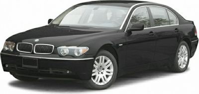 Front and side exterior view of luxury sedan with alloy wheels.