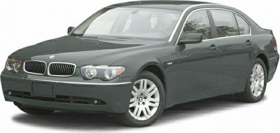 Front view of a luxury sedan with dual round headlights and kidney grille