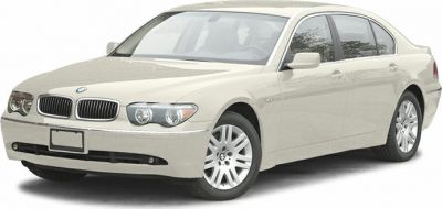 Front angle view of sedan with quad headlights and kidney grille
